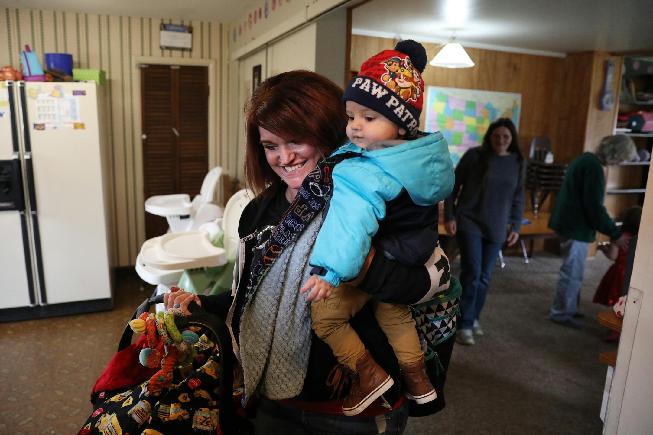 Ashley Benson, a mother of four who went through Sanford Bemidji Medical Center's First Steps program to help pregnant opioid addicts wean off their addictions, picked up her sons Raymond Burnette, 15-months, and Graysen Burnette, 4-months, from daycare.