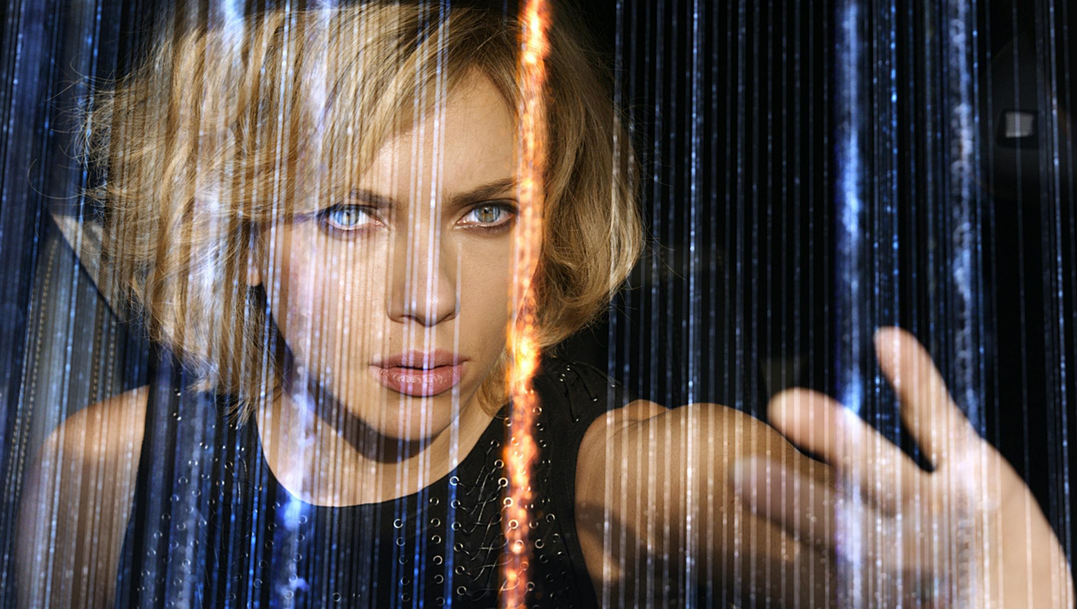 This image released by Universal Pictures shows Scarlett Johansson in a scene from "Lucy." (AP Photo/Universal Pictures) ORG XMIT: MIN2014072314440646