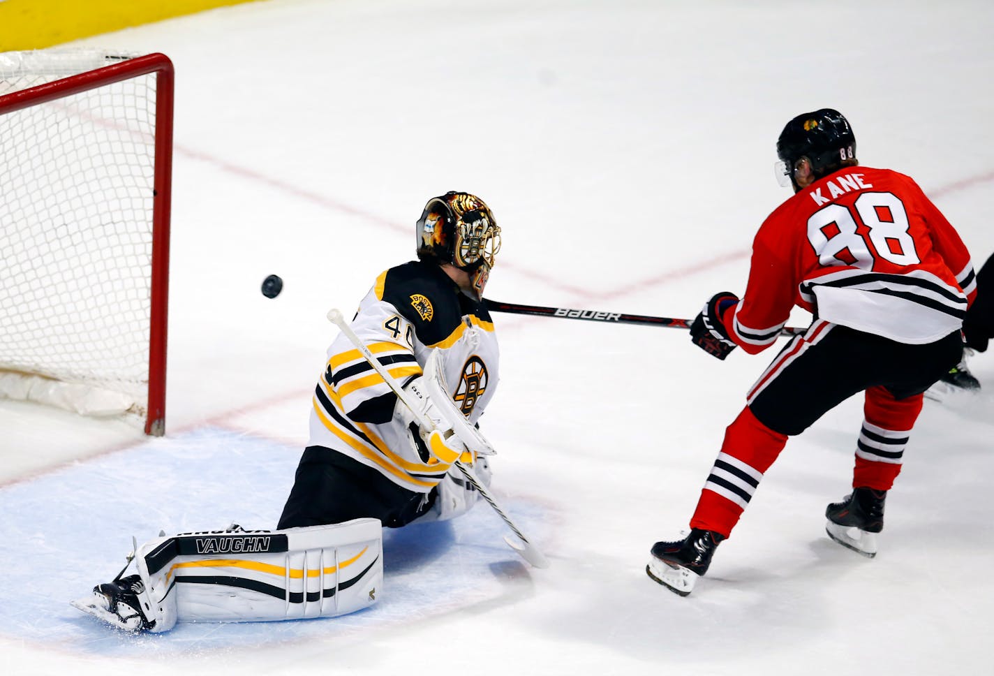 Chicago Blackhawks right wing Patrick Kane (88) scores a goal past Boston Bruins goalie Tuukka Rask (40) during the first period of an NHL hockey game Sunday, April 3, 2016, in Chicago. (AP Photo/Jeff Haynes)