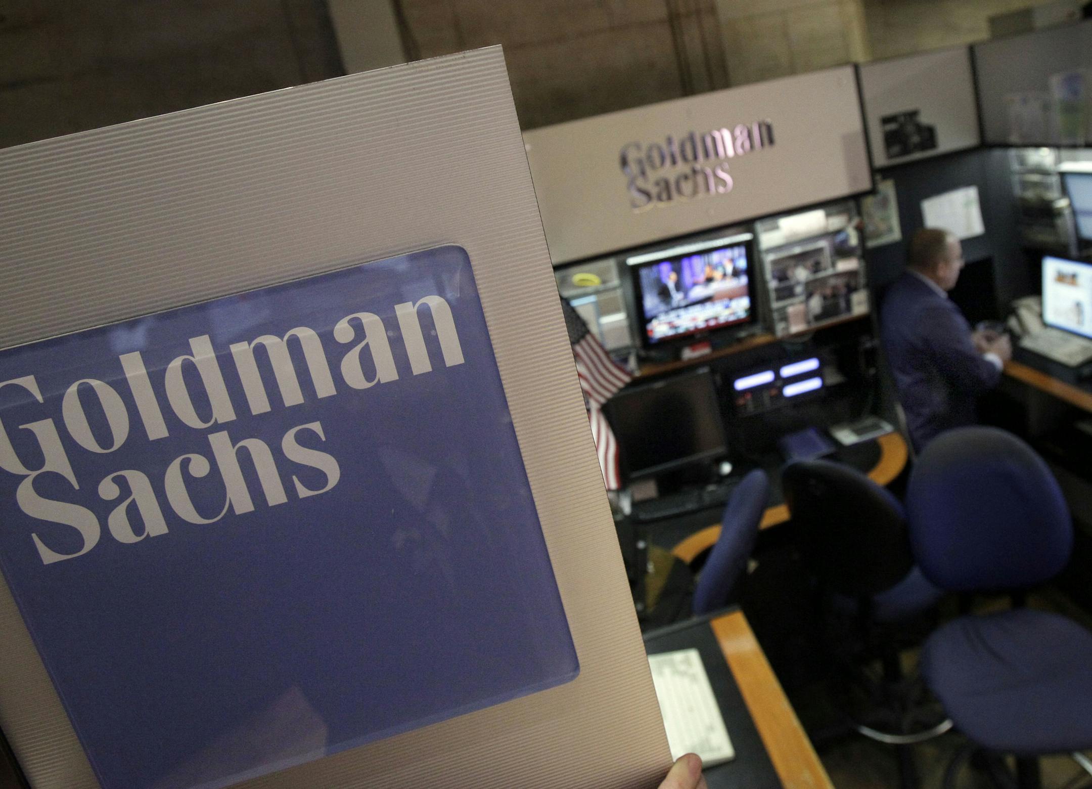 A trader works in the Goldman Sachs booth on the floor of the New York Stock Exchange Thursday, March 15, 2012. Greg Smith, an executive director at Goldman Sachs, resigned with a blistering public essay that accused the bank of losing its "moral fiber," putting profits ahead of customers' interests and dismissing customers as "muppets." (AP Photo/Richard Drew)
