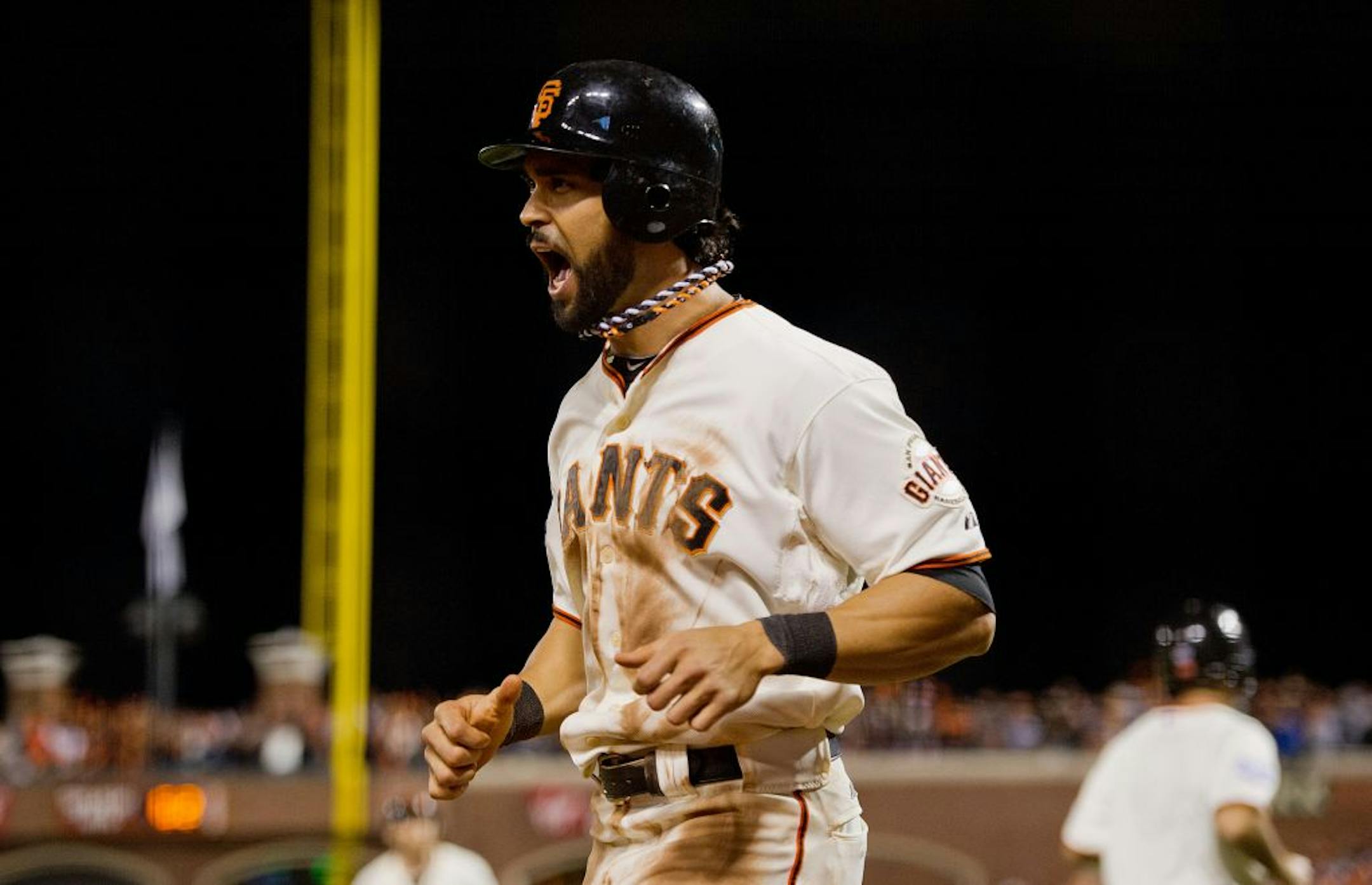 San Francisco Giants' Angel Pagan scores in the eighth inning on a sacrifice by Hunter Pence against the Detroit Tigers in Game 2 of the 2012 World Series at AT&T Park on Thursday, October 25, 2012, in San Francisco, California. The Giants won, 2-0, to take a 2-0 series lead.