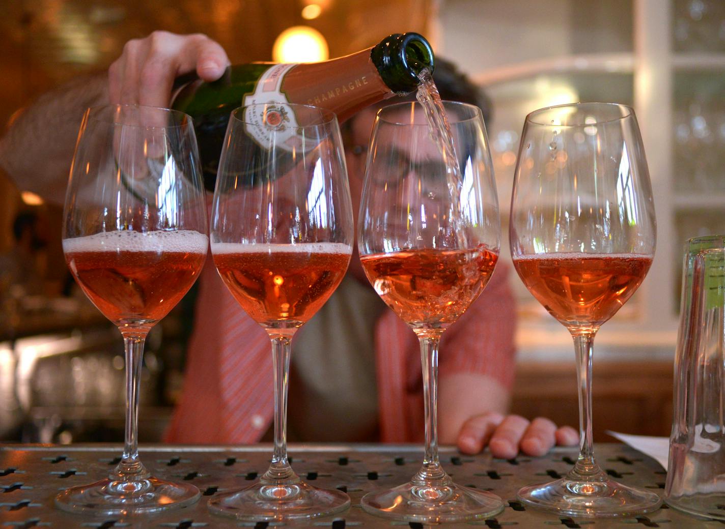 St. Genevieve bartender, Steve Cruze, pours four glasses of the restaurant's most popular rose champagne, Marc Hebrart Brut Rose. ] (SPECIAL TO THE STAR TRIBUNE/BRE McGEE) **St. Genevieve, Steve Cruze (bartender)