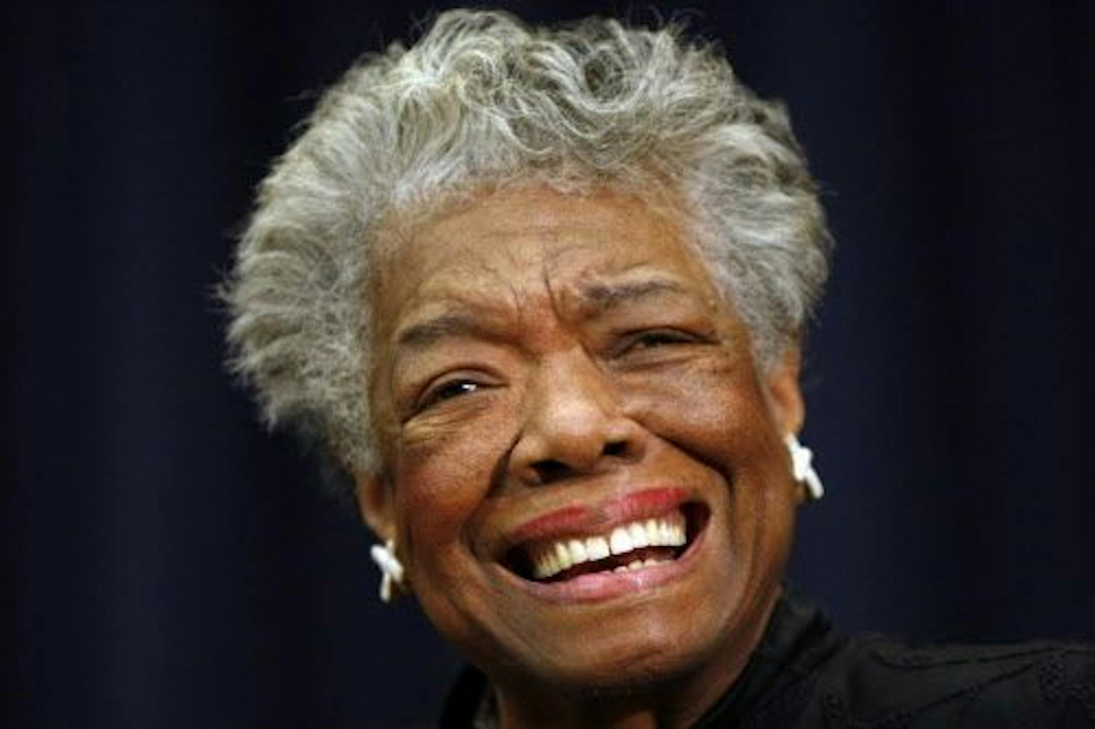 FILE - In this Nov. 21, 2008 file photo, poet Maya Angelou smiles at an event in Washington.