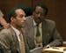 Defense attorney Johnnie L. Cochran Jr., puts his arm around murder defendant O.J. Simpson after the ex-football player stood in a Los Angeles courtro