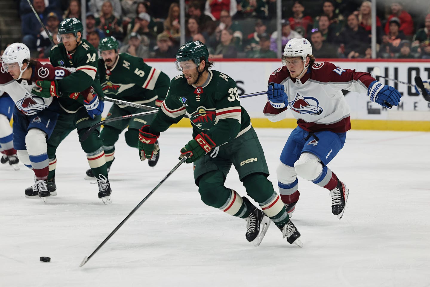 Minnesota Wild right wing Ryan Hartman (38) handles the puck against the Colorado Avalanche during the second period of an NHL hockey game Monday, Oct. 17, 2022, in St. Paul, Minn. (AP Photo/Stacy Bengs)