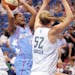 Atlanta Dream's Ivory Latta goes up for a shot against Minnesota Lynx's Kristen Rasmussen during the second quarter of a WNBA basketball game, Wednesd