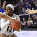 Rice guard Erica Ogwumike (13) fights through the defense of Middle Tennessee forward Jordan Majors, left, in the second half of an NCAA college baske