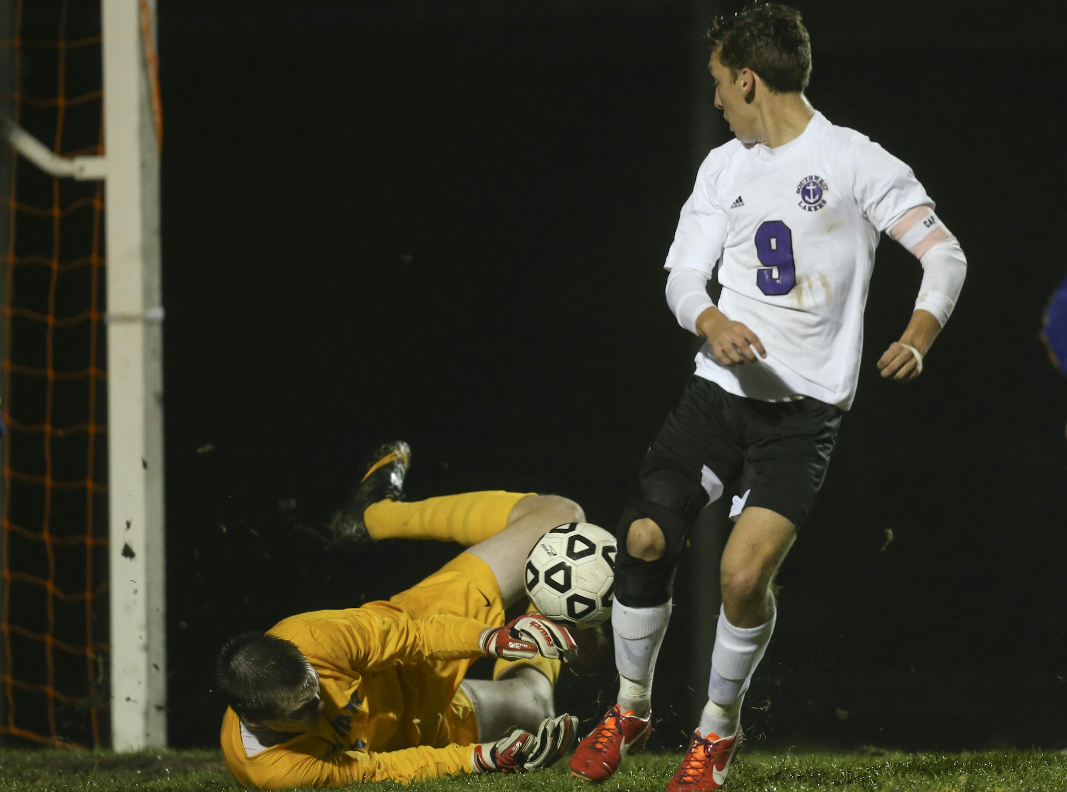 Southwest scored three unanswered second half goals to defeat Wayzata High School 3-2 for the boy's soccer section 6, class AA championship Tuesday night, October 15, 2013 at Southwest High School in Minneapolis. Wayzata goalie Troy Louwagie tried to smother the ball after making a first half stop while the Lakers' Diego Rios looked back for the possible rebound. ] JEFF WHEELER &#x201a;&#xc4;&#xa2; jeff.wheeler@startribune.com