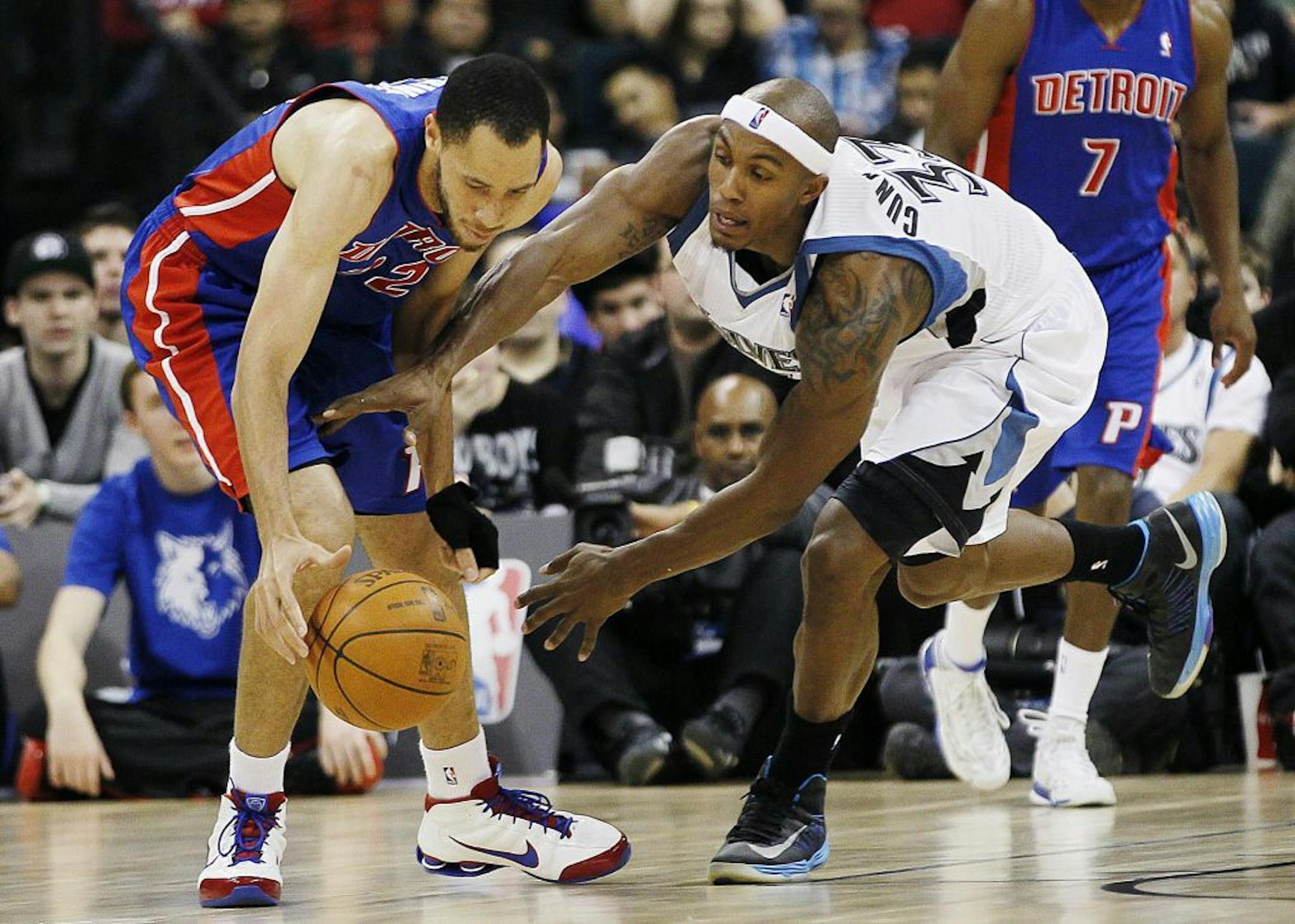 Dante Cunningham and Detroit Pistons' Tayshaun Prince battle for a loose ball.