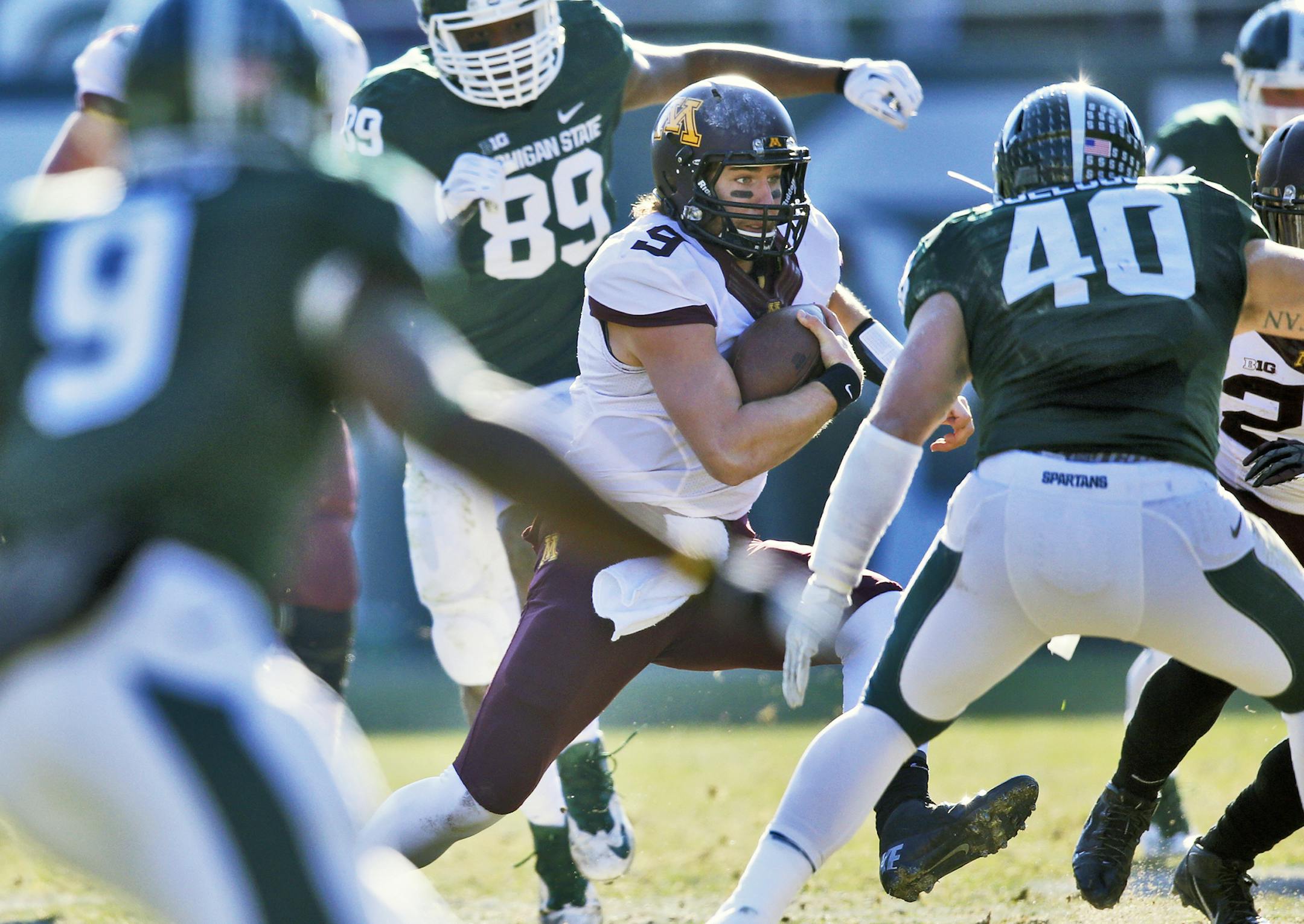 Minnesota Gophers vs. Michigan State Spartans. Michigan State won 14-3. Minnesota quarterback Philip Nelson was hemmed in by the Michigan State defense as he attempted to gain yards on a keeper in first half action. (MARLIN LEVISON/STARTRIBUNE(mlevison@startribune.com)