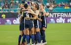 North Carolina Courage players, including forward Lynn Williams (9), celebrate the team's first goal against Olympique Lyonnais in the July 29 finals 