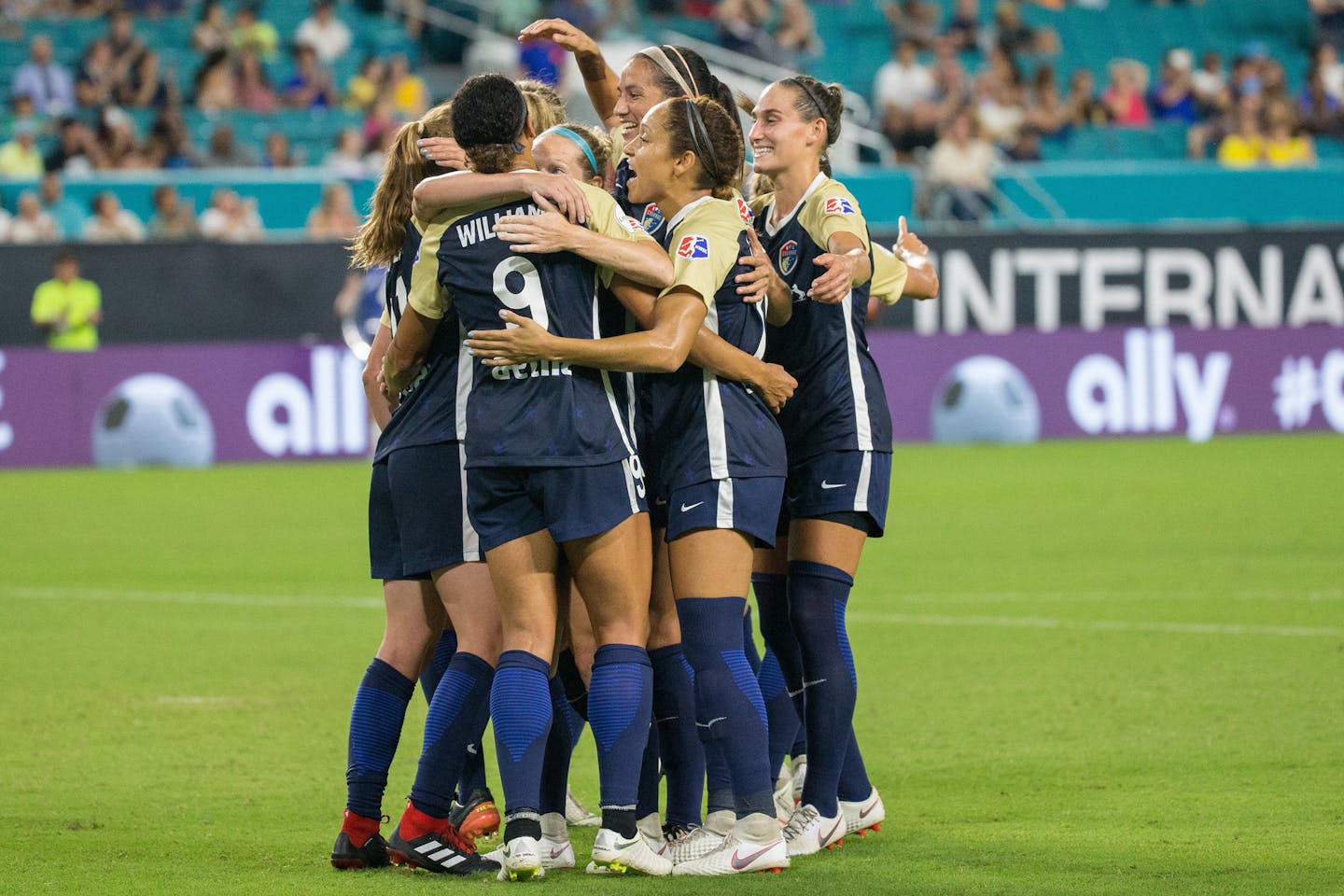 North Carolina Courage players, including forward Lynn Williams (9), celebrate the team's first goal against Olympique Lyonnais in the July 29 finals of the 2018 Women's International Champions Cup at Hard Rock Stadium in Miami Gardens, Fla.