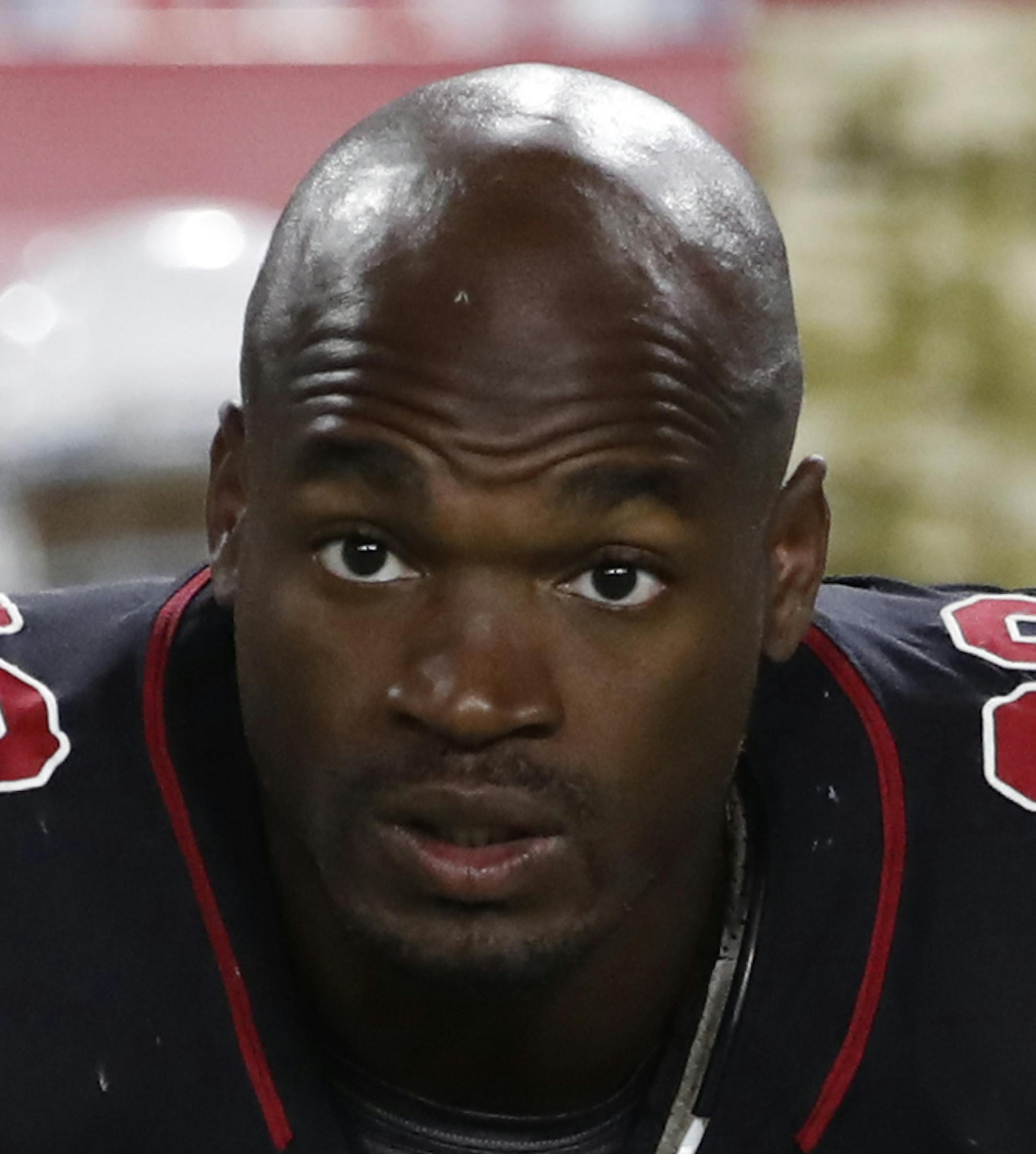 FILE - In this Nov. 9, 2017 file photo Arizona Cardinals running back Adrian Peterson (23) watches at the sideline during an NFL football game against the Seattle Seahawks in Glendale, Ariz. The Washington Redskins have signed Peterson. The team announced the deal Monday, Aug. 20, 2018 after meeting with him. (AP Photo/Rick Scuteri, file)