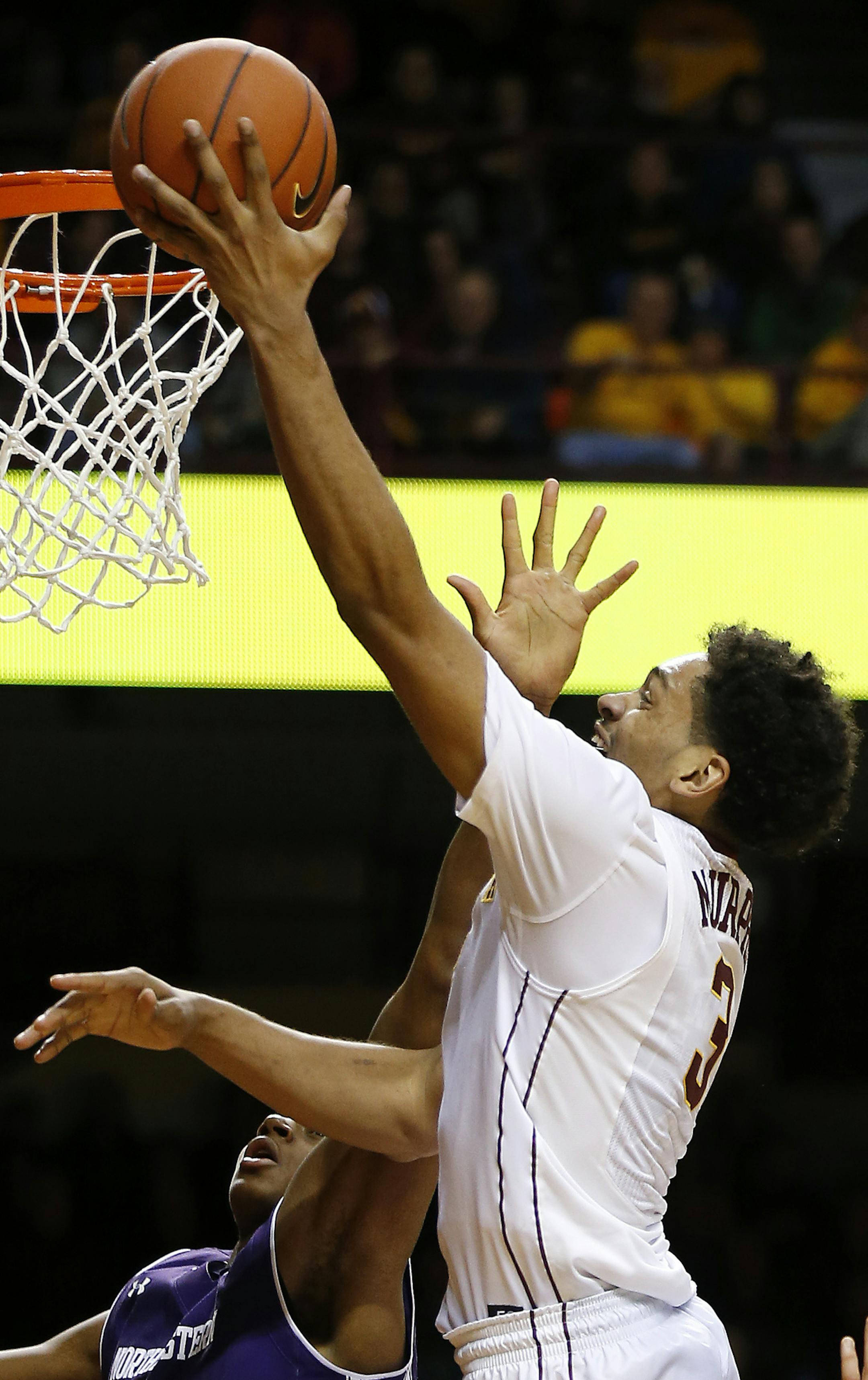 Minnesota forward Jordan Murphy (3) goes up to the basket against Northwestern center Dererk Pardon (5) in the second half of an NCAA college basketball game, Saturday, Jan. 9, 2016, at Williams Arena in Minneapolis. (AP Photo/Stacy Bengs)