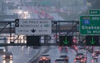 Heavy rain soaked the metro area Monday morning, messing with the commute and bringing with it high winds. Here, traffic was at a stand still on I-35W