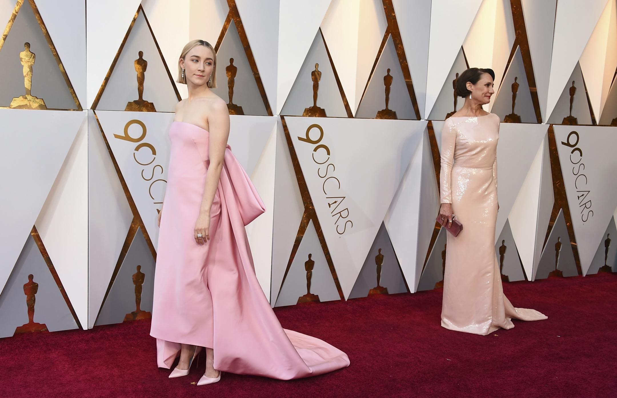 Saoirse Ronan, left, and Laurie Metcalf arrive at the Oscars on Sunday, March 4, 2018, at the Dolby Theatre in Los Angeles.