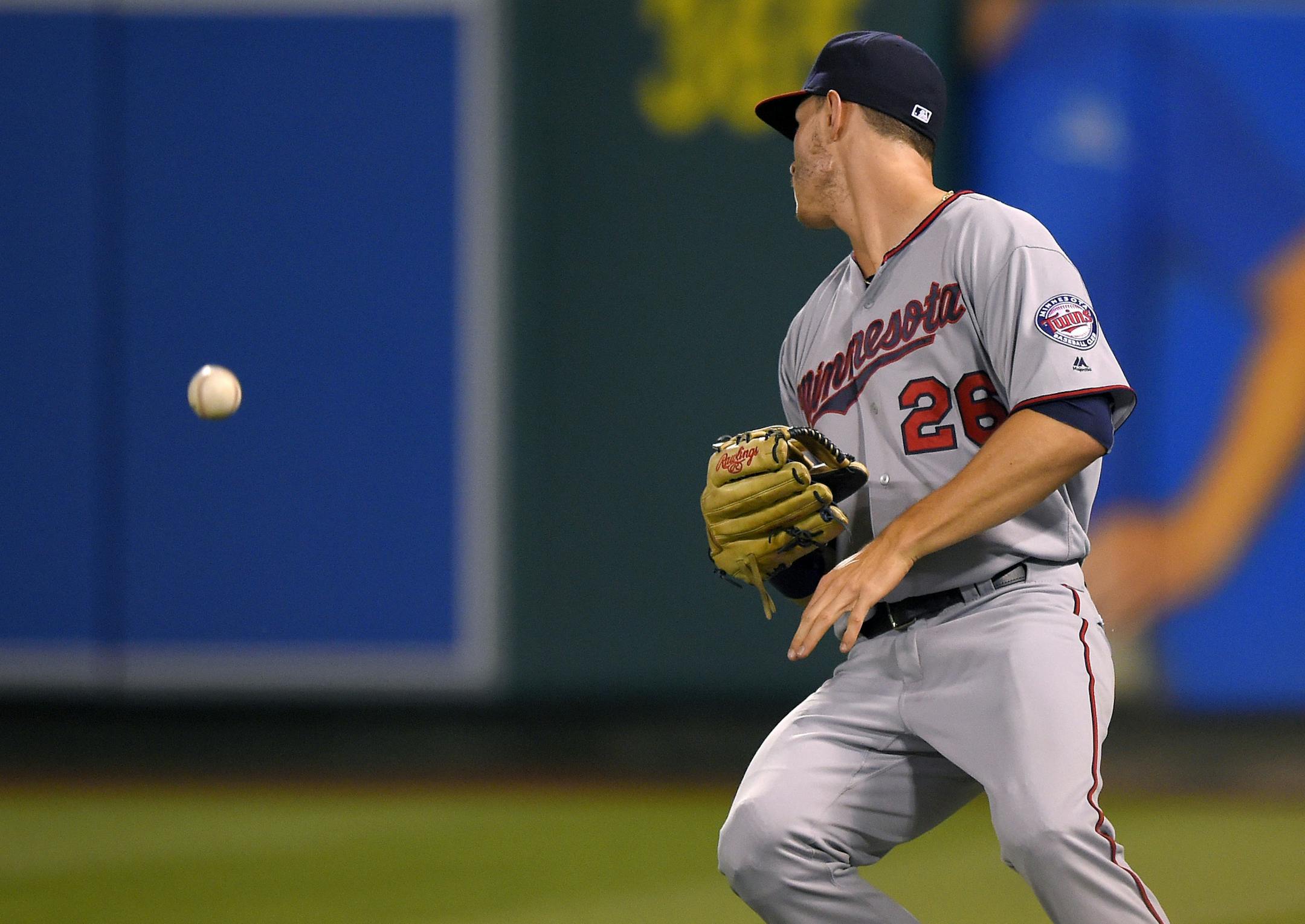 Minnesota Twins right, fielder Max Kepler misplays a fly ball hit by Los Angeles Angels' Jett Bandy for a single during the fifth inning of a baseball game, Wednesday, June 15, 2016, in Anaheim, Calif. (AP Photo/Mark J. Terrill)