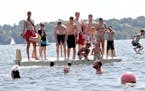 A platform on Lake Harriet was a crowded spot for cooling off Wednesday, July 20, 2016, in Minneapolis, MN.(DAVID JOLES/STARTRIBUNE)djoles@startribune