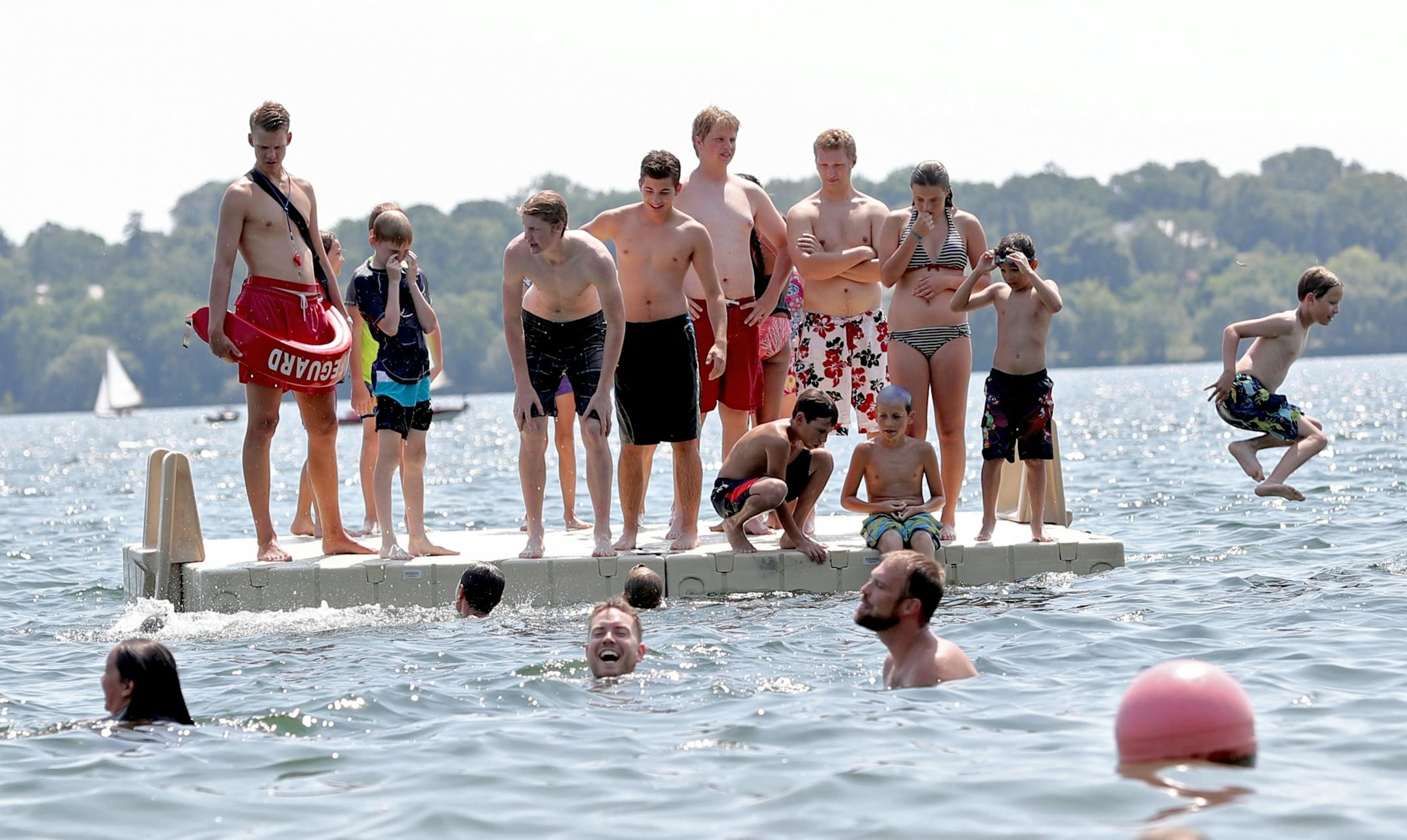 A platform on Lake Harriet was a crowded spot for cooling off Wednesday, July 20, 2016, in Minneapolis, MN.(DAVID JOLES/STARTRIBUNE)djoles@startribune Hot weather features