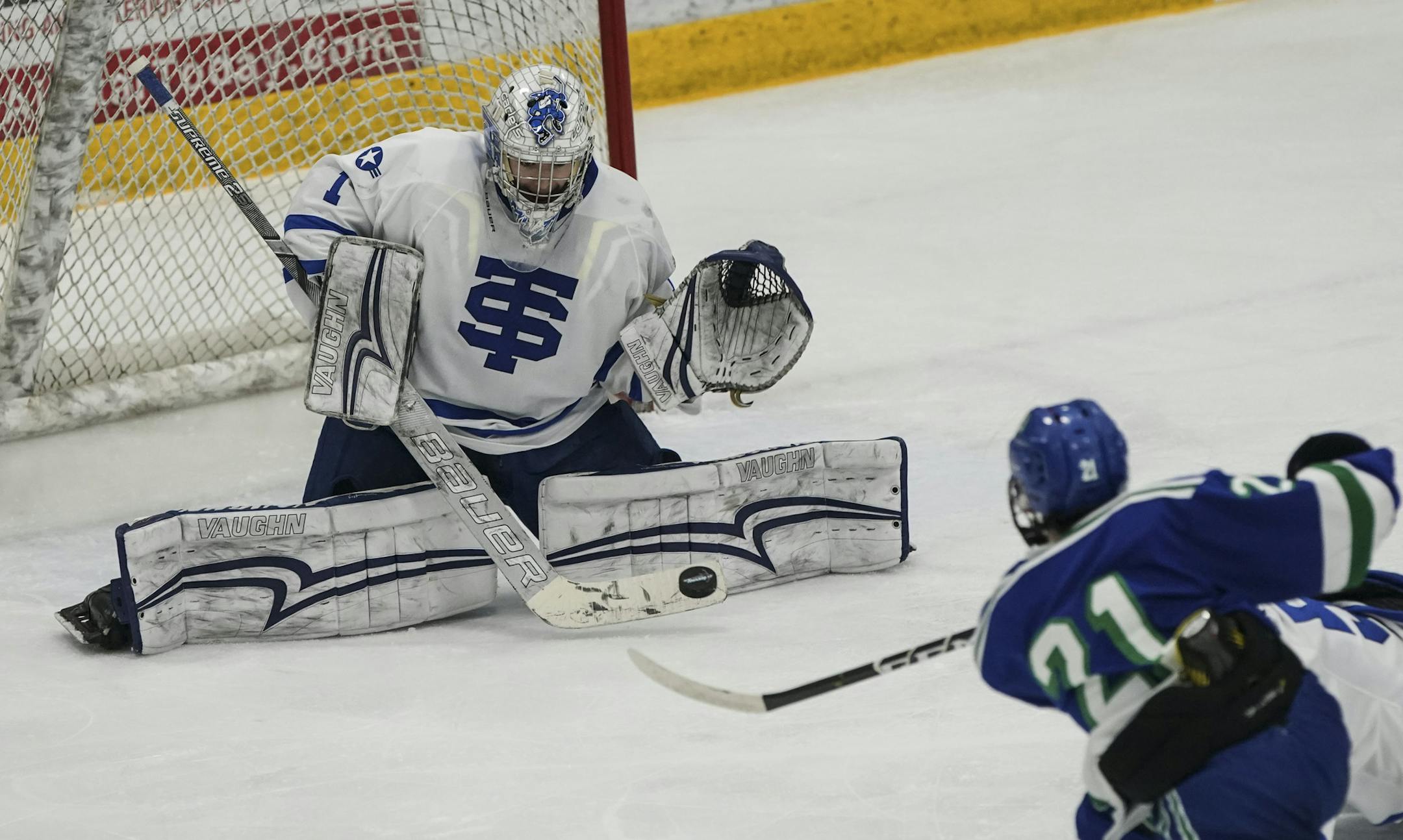 St. Thomas Academy goaltender Muzzy Donohue (1) blocked a shot on goal by Eagan High School forward Ethan Pearson (21) in the third period. St. Thomas Academy won 4-1. ] RENEE JONES SCHNEIDER ¥ renee.jones@startribune.com The Section 3AA boys' hockey championship of Edina verses Eagan in Edina, Minn., on Thursday, February 28, 2019.