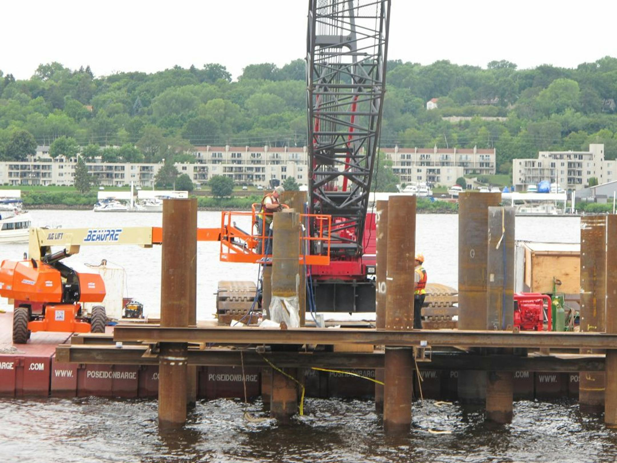 Bolander and Sons, a St. Paul company, has finishing pounding test piers into St. Croix River bedrock. Scientific tests come next. Photo by Kevin Giles