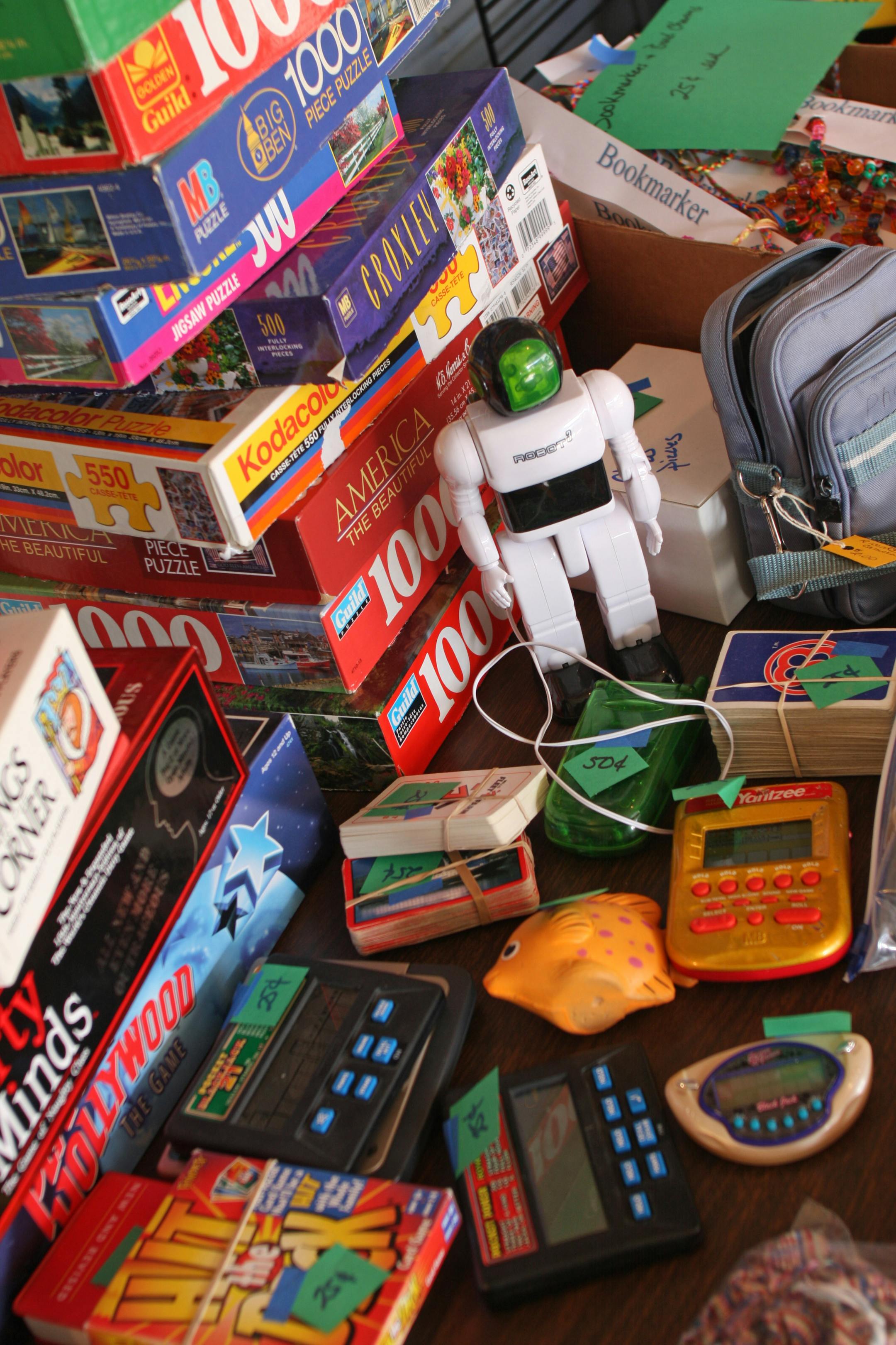 Games, toys and puzzles filled a table at the Carlson multifamily garage sale.