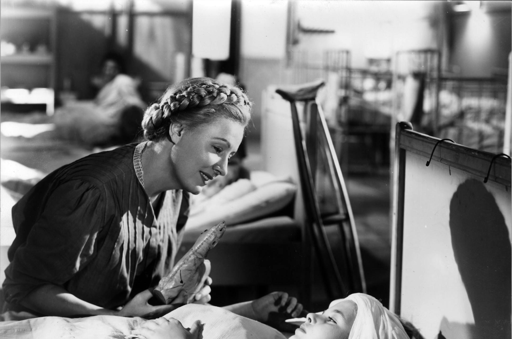 Irene Dunne (at left) stars in the title role of the 1947-48 movie "I Remember Mama," about a Norwegian immigrant family living in San Francisco in the early 1900s. Here, she pretends to be a scrubwoman, and works her way into Dagmar's ward and sings her to sleep. File photo courtesy of RKO Pictures. ORG XMIT: MIN2013050910542552