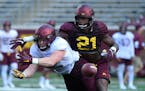 Gophers linebacker Kamal Martin (21) defended successfully against a pass intended for tight end Ko Kieft in practice. Martin did not play in the seas