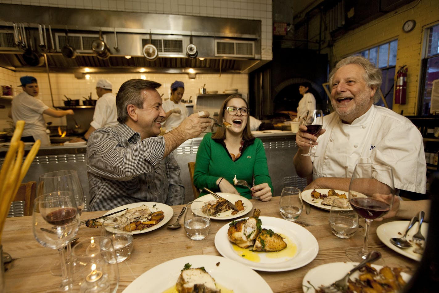 Chef Daniel Boulud, left, and his daughter, Alix, eating the roasted chicken at Barbuto with the restaurant's chef, Jonathan Waxman, in New York, March 12, 2012. Though New York's starred chefs could dine anywhere, many choose straightforward fare when they kick back. (Michael Nagle/The New York Times) ORG XMIT: XNYT19