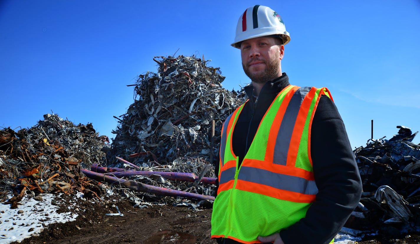 Shane Alsdurf of AMG Alliance Co. walked near a pile of steel 6 stories high that has been reclaimed from the demolition of the Metrodome. ].The construction materials are being recycled from the Metrodome's demolition, mostly steel, concrete and soil. AMG Alliance Co is recycling iron rebar and steel from the Dome Richard.Sennott@startribune.com Richard Sennott/Star Tribune Minneapolis, Minn. Thursday 3/20/2014) ** (cq)