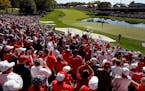 Fans cheered after a shot out of the sand trap by Patrick Reed on the 16th hole during the Ryder Cup at Hazeltine National in Chaska.