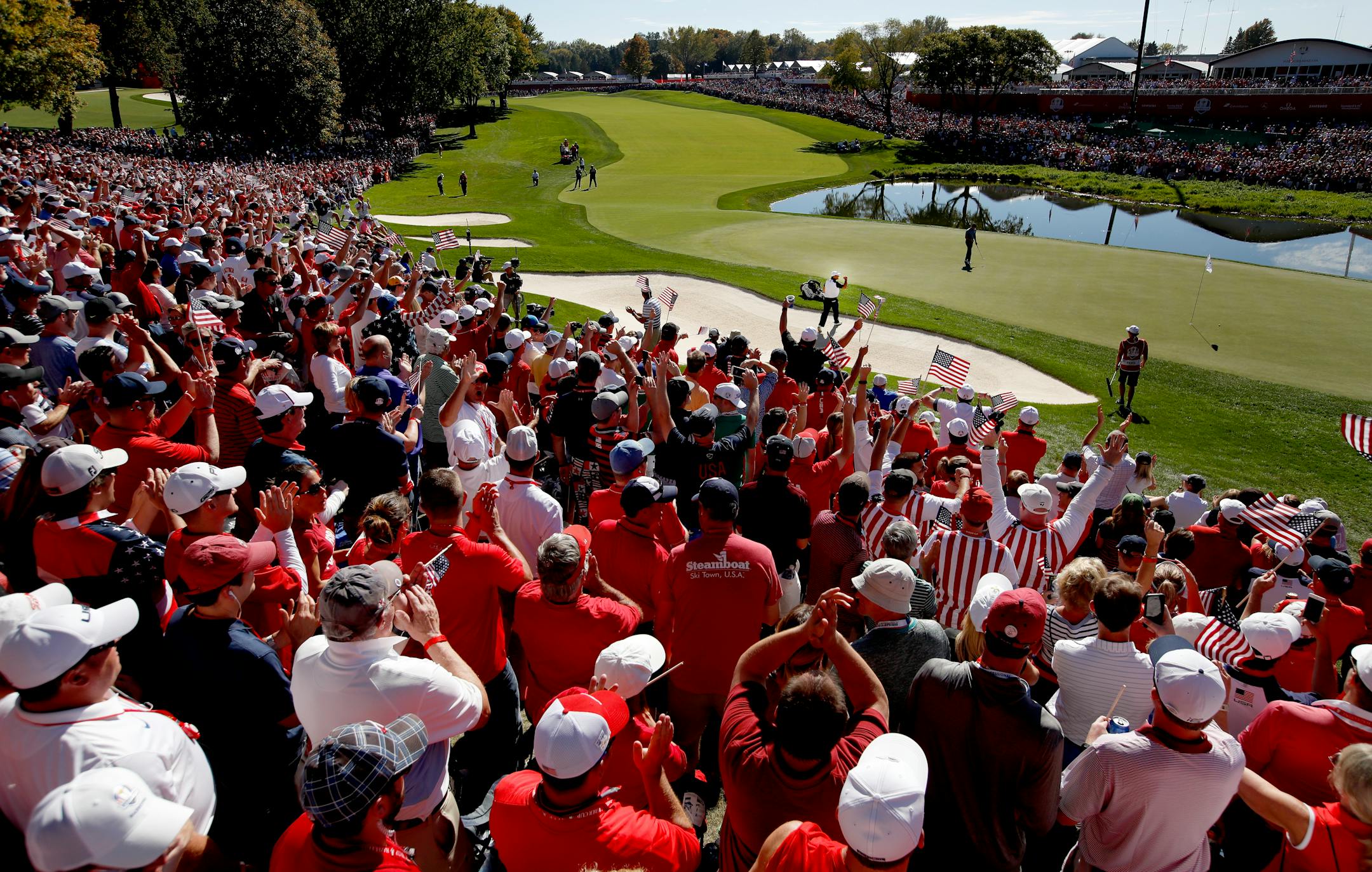 Fans cheered after a shot out of the sand trap by Patrick Reed on the 16th hole during the Ryder Cup at Hazeltine National in Chaska.