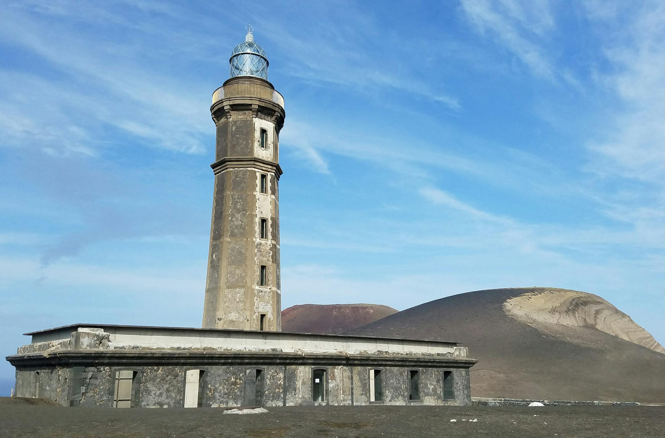 A lighthouse sits partially buried in ash after the cataclysmic 1950s eruption of the Capelhinos volcano on Faial. Simon Peter Groebner*simon.groebner@startribune.com