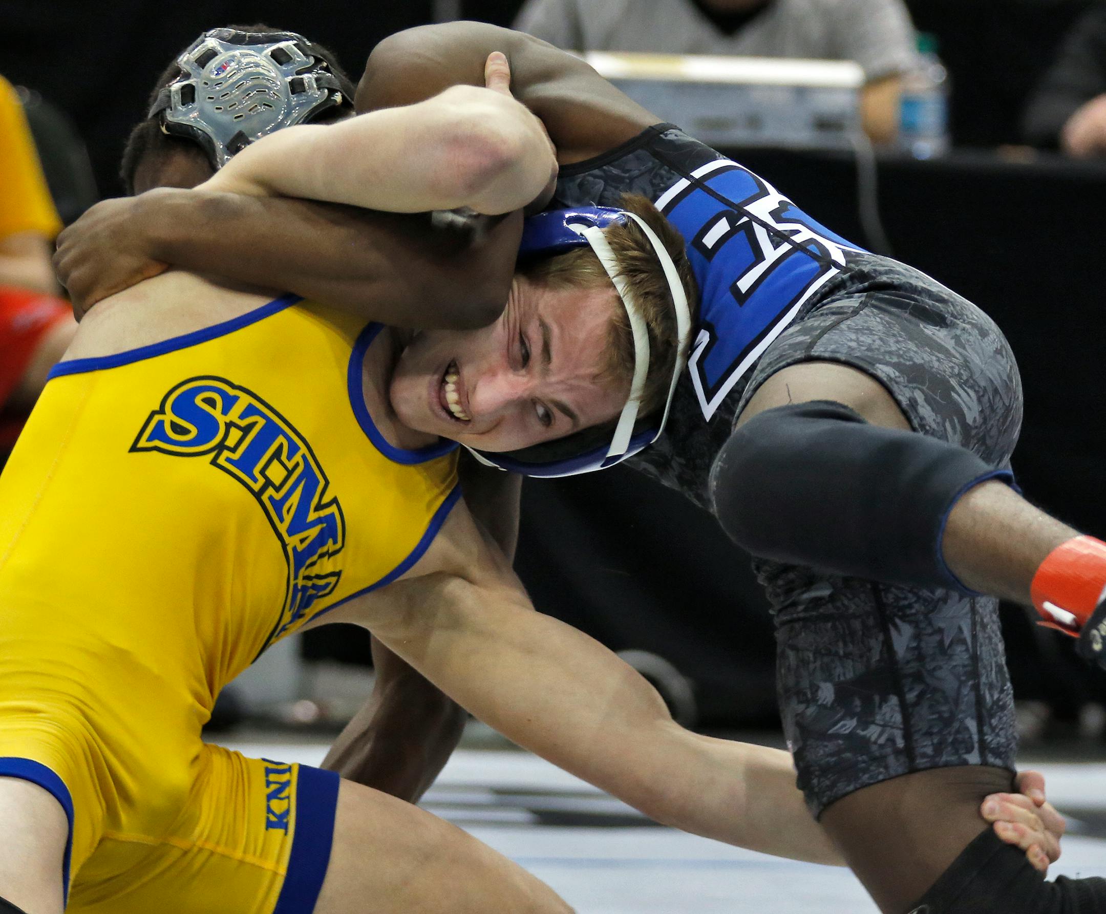 St. Michael-Albertville's Tommy Thorn, bottom, wrestled Eastview's George Farmah in the Class 3A 126 lb championship match last winter (Star Tribune file photo)