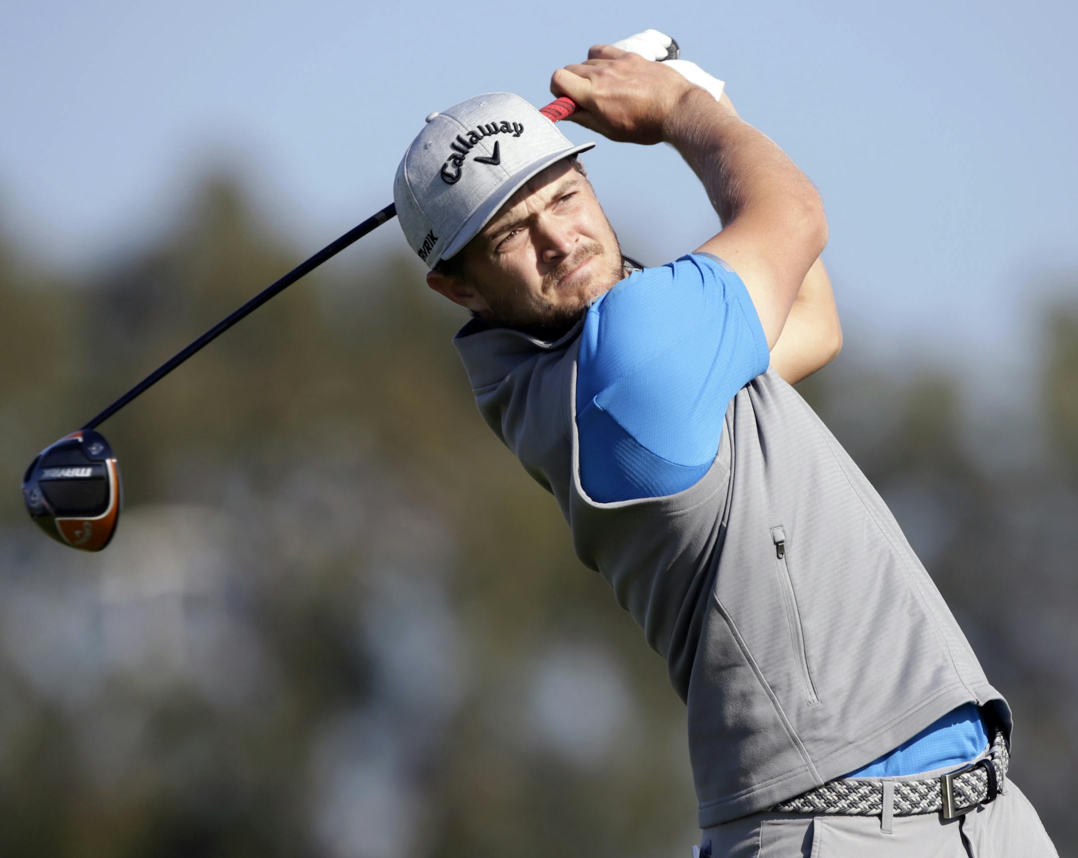 Sebastian Cappelen of Denmark plays his shot from the second tee on the Torrey Pines South Course during the first round of The Farmers Insurance golf tournament in San Diego, Thursday, Jan. 23, 2020. (AP Photo/Alex Gallardo)