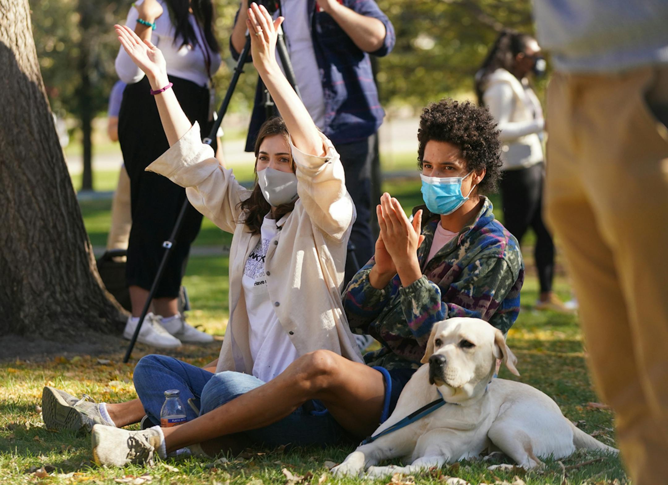 Jocelyn Landwehr and Sam Bogan were accompanied by Yuba, a service dog in training, at an event with Sen. Tina Smith and Rep. Ilhan Omar at the University of Minnesota on Tuesday.