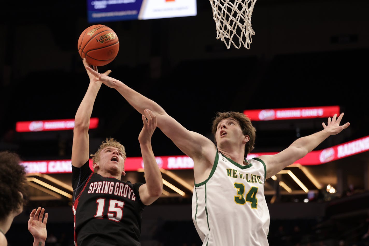 New Life Academy's Colton Hendricks (34) attempts to block Tysen Grinde's shot in the first half. Hendricks led the Eagles' scoring with 13 points. Photo by Cheryl A. Myers, SportsEngine