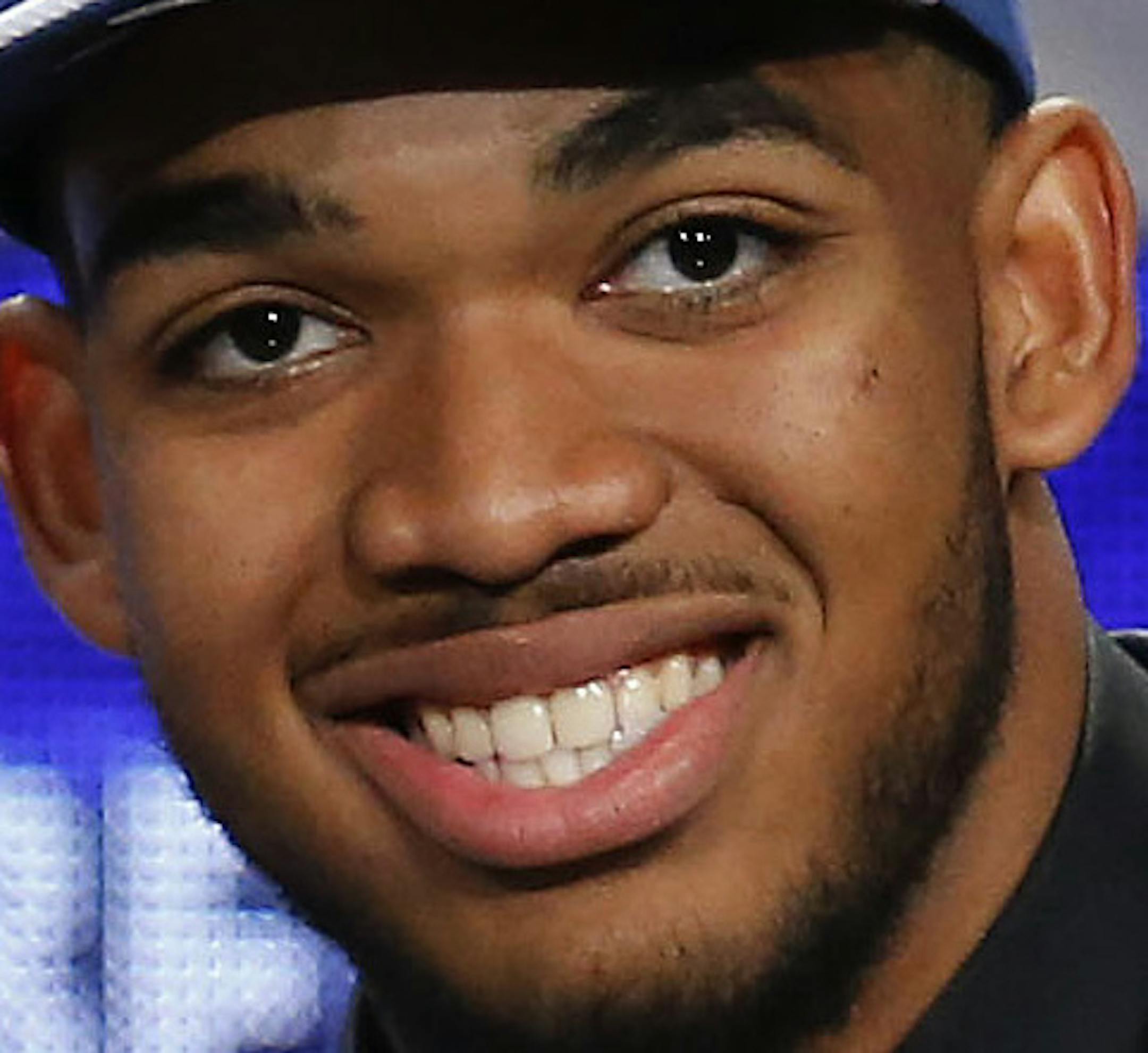 Karl-Anthony Towns, right, poses for a photo with NBA Commissioner Adam Silver after being announced as the top pick during the NBA basketball draft by the Minnesota Timberwolves, Thursday, June 25, 2015, in New York. (AP Photo/Kathy Willens)