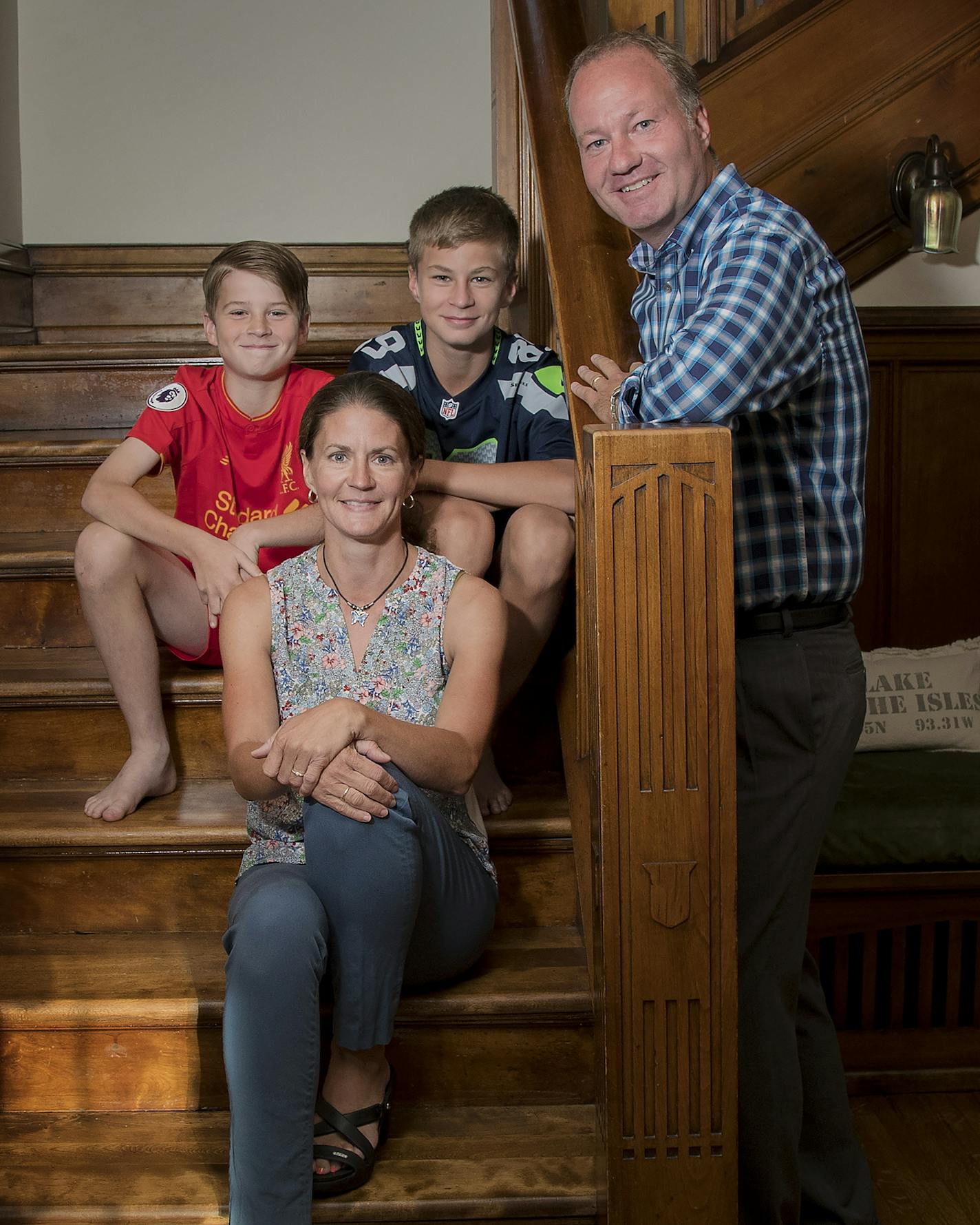 Lleyton, 12, Heather, Callum, 13, and Jason Bristow photographed in their Minneapolis home. ] CARLOS GONZALEZ &#xef; cgonzalez@startribune.com - August 22, 2017, Minneapolis, MN, Home of the month- 1915 Tudor Revival updated with three additions - including a English pub - for a family of sports fans, by Christopher Strom Architects, .Jason and Heather Bristow and architect Chris Strom give us a tour of the new additions on their 1900s Tudor Revival.