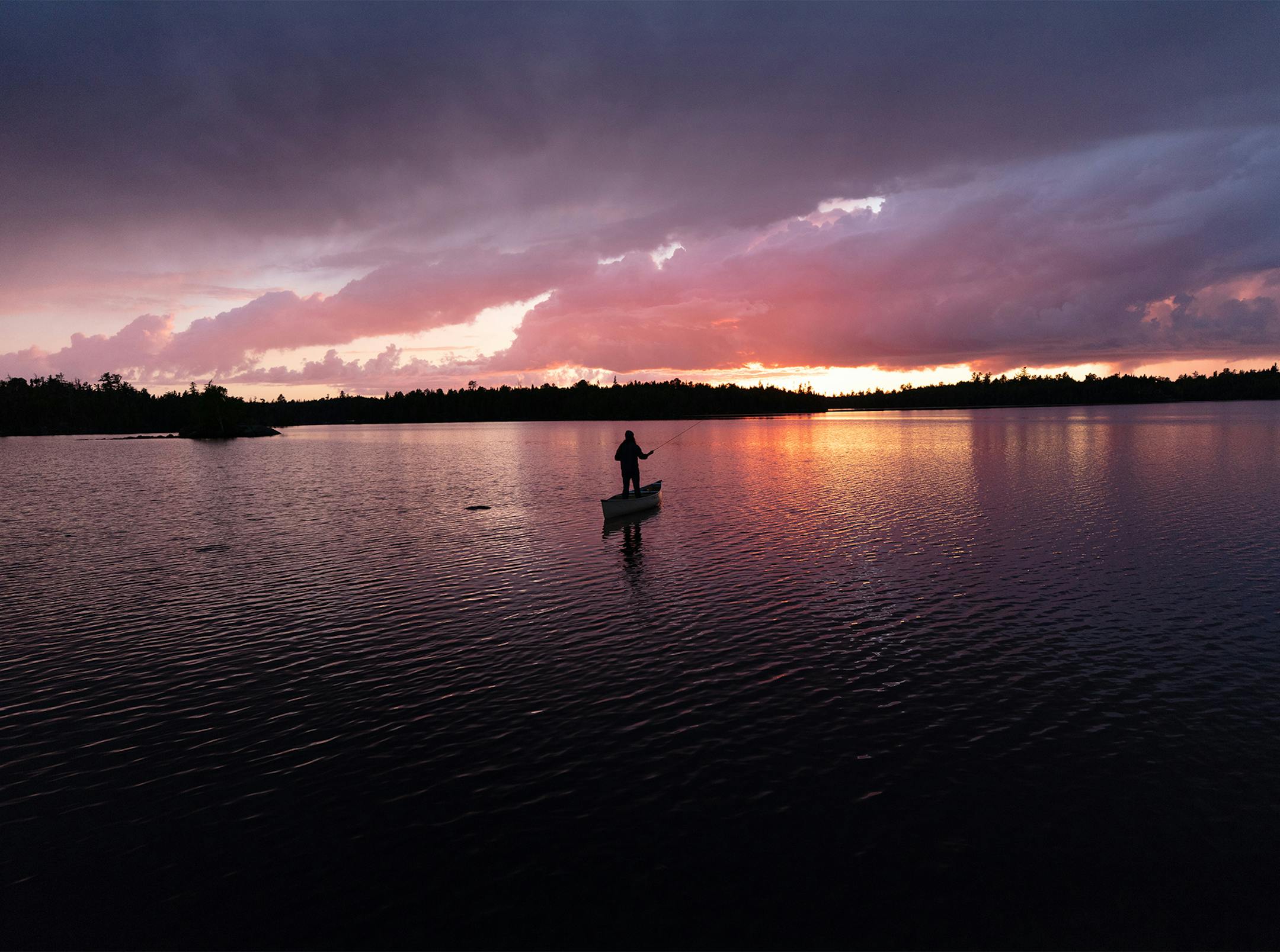Riverhorse Nakadate paddled and fished under a summer sunset in the BWCA, just a few feet away from camp.