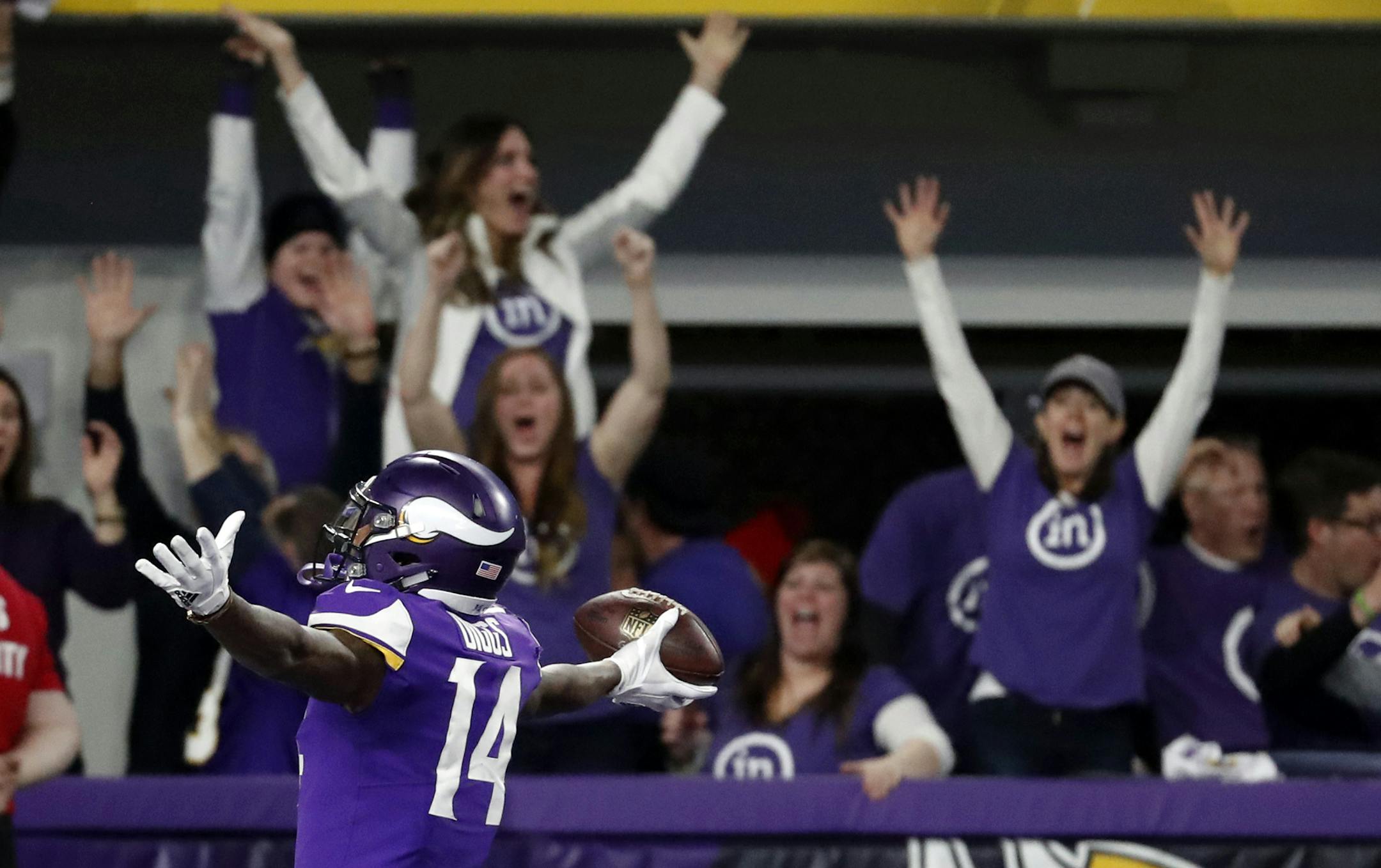 FILE - In this Sunday, Jan. 14, 2018, file photo, Minnesota Vikings wide receiver Stefon Diggs (14) celebrates in the end zone after a making the game-winning touchdown against the New Orleans Saints late the second half of an NFL divisional football playoff game in Minneapolis,. Diggs has had his ups and downs throughout his life and career, but there's been no greater high on the field than his 61-yard touchdown reception on the final play for Minnesota to beat New Orleans and advance in the p