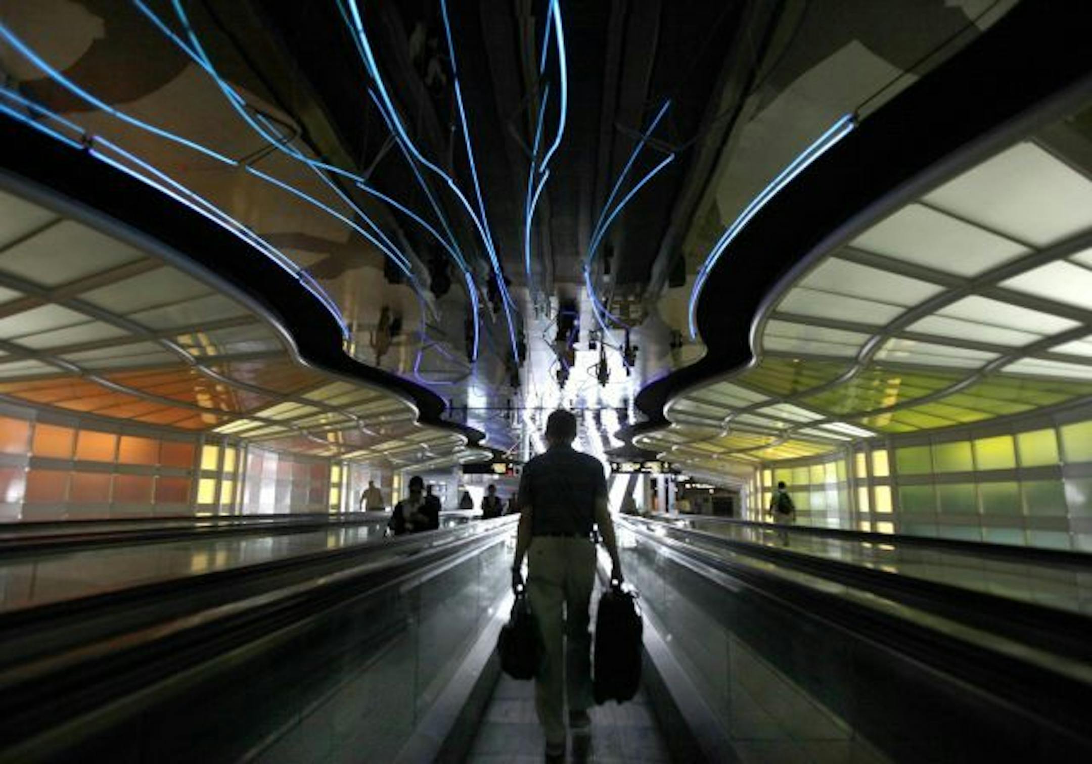 A traveler makes his way through Cihcago O'Hare International Airport in Chicago on Sunday, June 28, 2009.