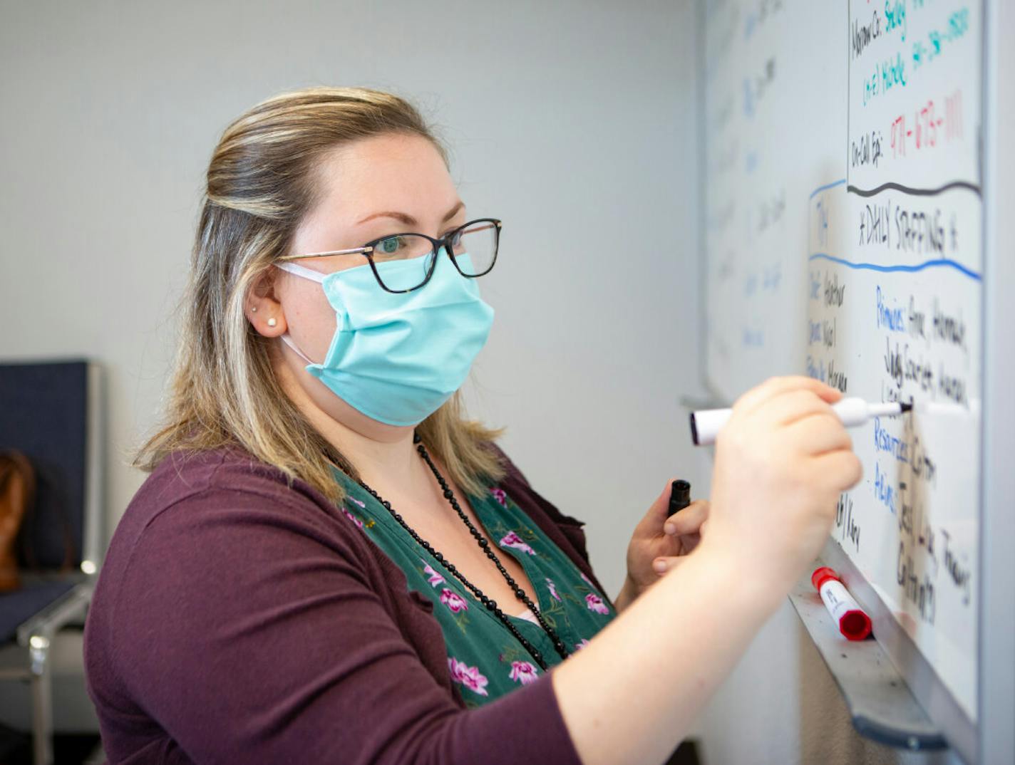 As young adults fuel a surge in new coronavirus cases across Minnesota, they're making it increasingly difficult for contact tracers to keep up. Above, registered nurse Heather Griggs updated a list for contact tracers in Oregon.