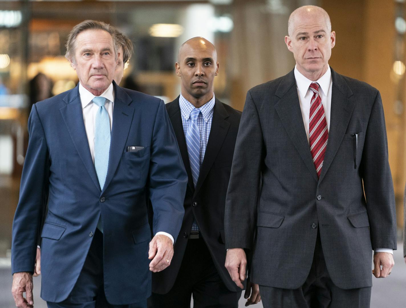 Former Minneapolis police officer Mohamed Noor, center, walked into the Hennepin County Courthouse for the verdict in the shooting death of Justine Ruszczyk Damond with his lawyers Peter Wold (left) and Thomas Plunkett (right) in Minneapolis on Tuesday.