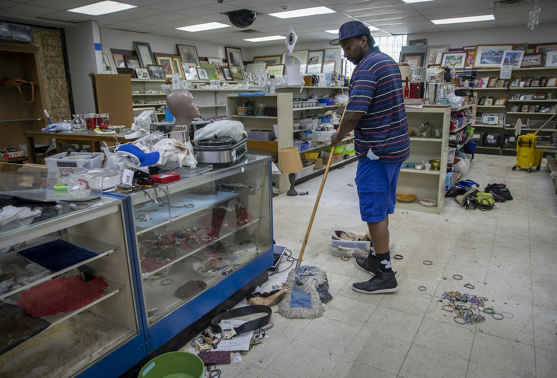 Wayne Berg worked with his staff on repairing and cleaning the heavily damaged St. Vincent de Paul thrift store, Friday, June 5, 2020 in Minneapolis, MN. Wayne Bugg said he'd seen anything like it in his life. Bugg is a former crack dealer with crack-addicted parents. About 23 years ago he started working at St. Vincent where he was encouraged to do something better with his life and paid his college tuition. Now he's St. Vincent's assistant executive director known for reaching out to help peop
