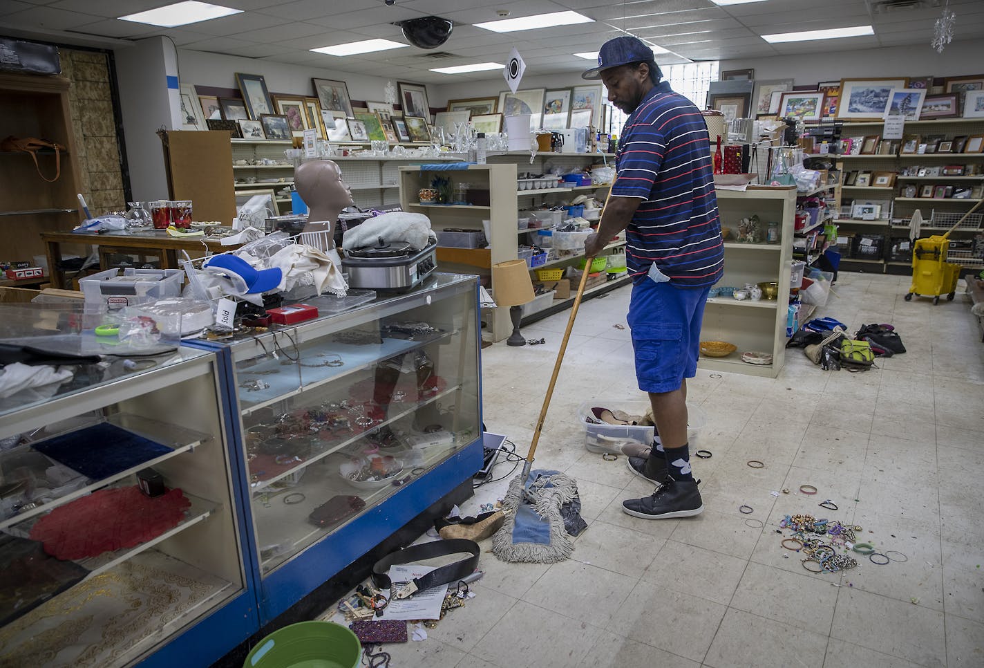 Wayne Berg worked with his staff on repairing and cleaning the heavily damaged St. Vincent de Paul thrift store, Friday, June 5, 2020 in Minneapolis, MN. Wayne Bugg said he'd seen anything like it in his life. Bugg is a former crack dealer with crack-addicted parents. About 23 years ago he started working at St. Vincent where he was encouraged to do something better with his life and paid his college tuition. Now he's St. Vincent's assistant executive director known for reaching out to help peop