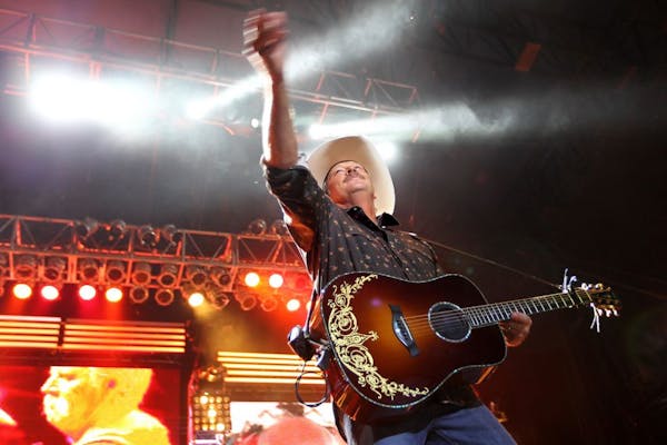 Alan Jackson threw guitar picks and t-shirts to the crowd as he performed at the Minnesota State Fair in Falcon Heights August 24, 2012.