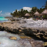 PHOTO MOVED IN ADVANCE AND NOT FOR USE - ONLINE OR IN PRINT - BEFORE DEC. 11, 2016. -- FILE -- Tourists at shaded tables along a rocky spot on the Yucatan coast in Tulum, Mexico, Aug. 2, 2014. By virtue of language, ease of transportation, expense or level of hospitality, some international travel destinations are especially well-suited to solo travelers. (David Freid/The New York Times)