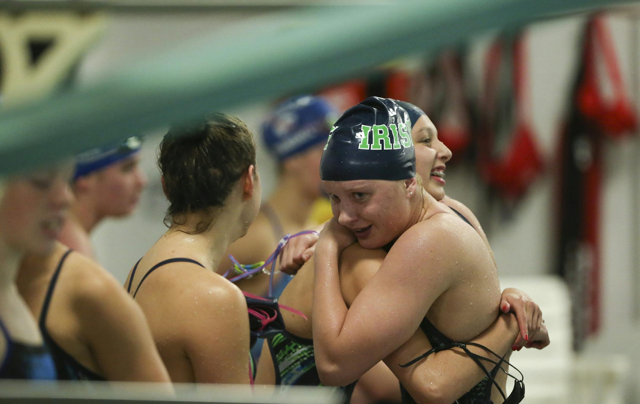 Rosemount's Anna Wenman was hugged by teammate Keely McLean after she swam the anchor leg of the 400 yard freestyle relay Tuesday night, which their team won. ] JEFF WHEELER ï jeff.wheeler@startribune.com The Rosemount girl's swim team faced Eagan in a meet at Rosemount Middle School Tuesday night, October 6, 2015.