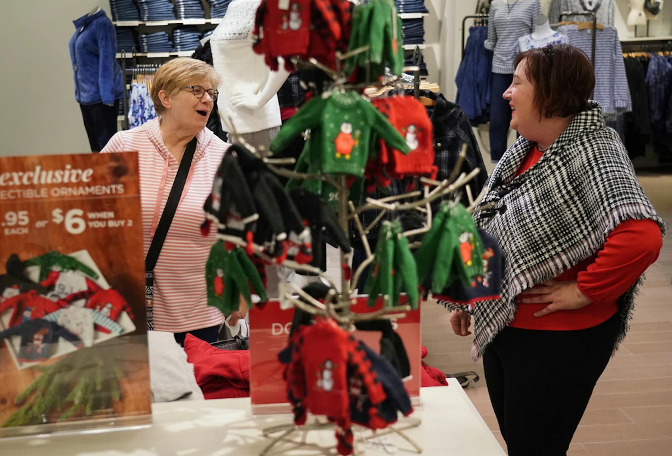 Mary Sund from Maple Plain and client stylist Stacy Meyer sang a holiday song inside the Christopher & Banks store on Black Friday 2019 at the Mall of America in Bloomington.
